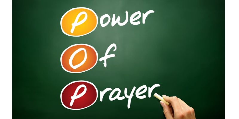 An image of someone writing the words Power Of Prayer on a black board to encourage children to pray and make a connection to God in your children