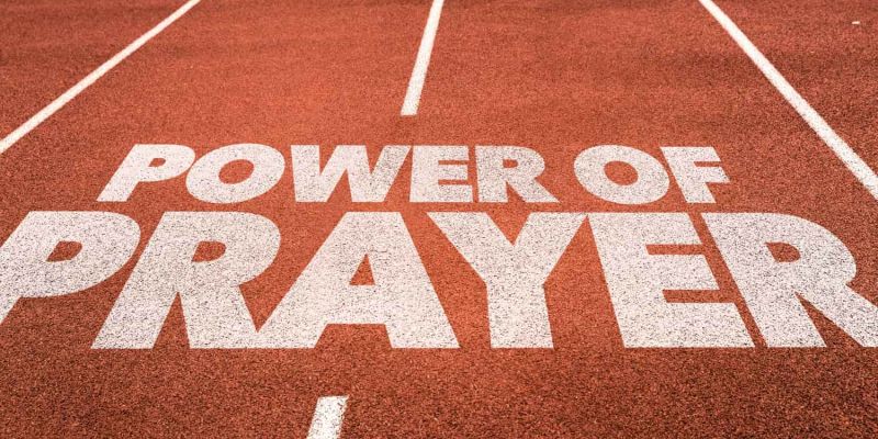 An image of the words Power of Prayer written on a running track encouraging children to pray in your children