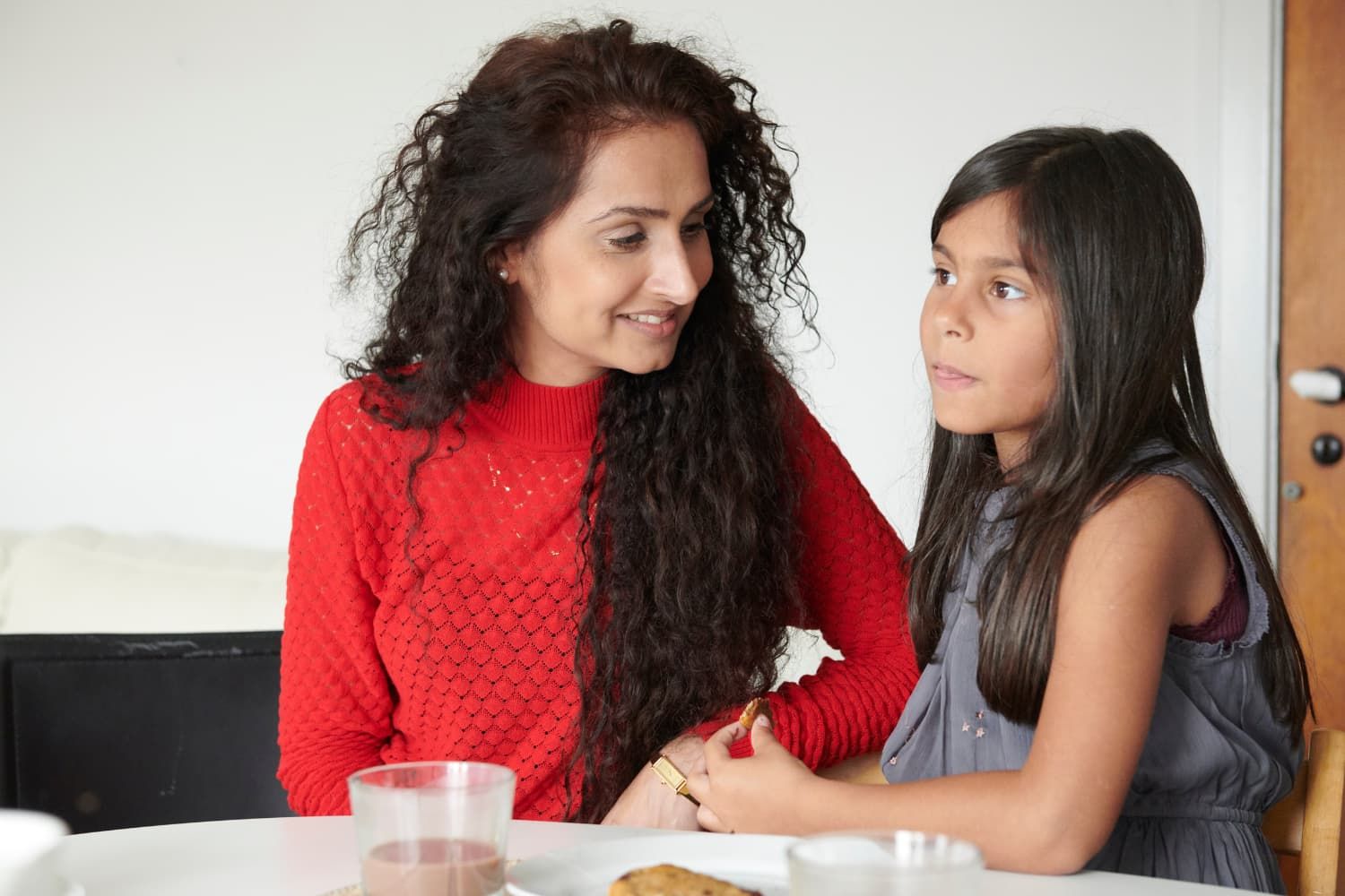 Image depicting a Sunday school teacher attentively observing a young girl, Ava, illustrating the importance of interpreting non-verbal cues in children